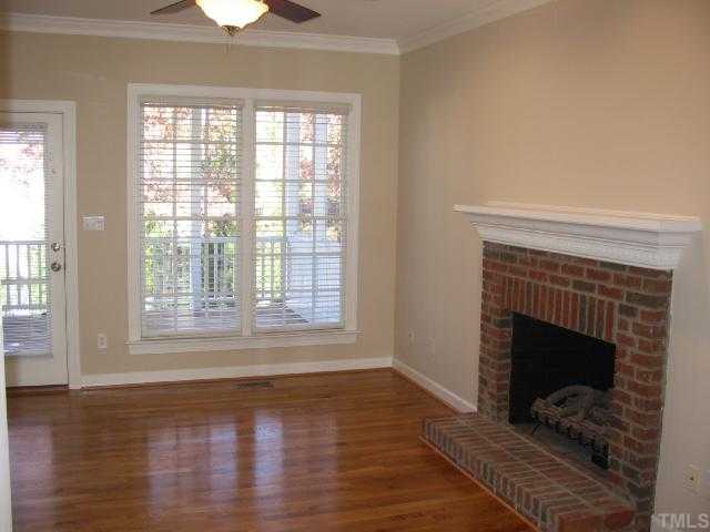 104 Lyncroft Lane Cary, NC 27519 - Photo 6 of 12 Family Room with Real Fireplace, Gas Logs, Hardwood Floors, New Paint, Two Inch Blinds!