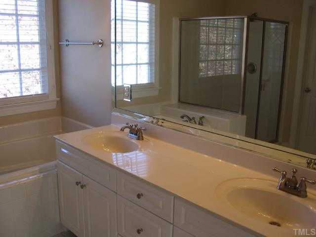 104 Lyncroft Lane Cary, NC 27519 - Photo 7 of 12 Master Bathroom Two vanitites, Garden Tub and Whirlpool!