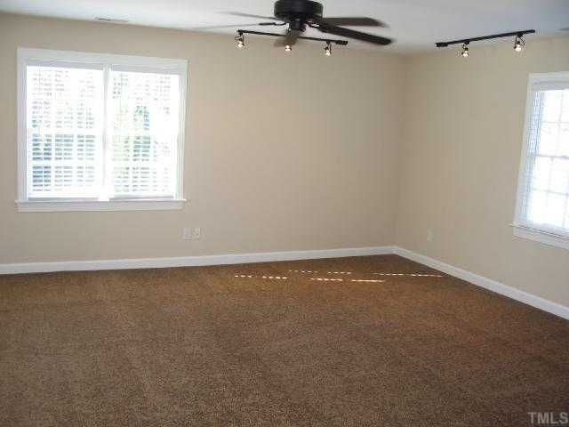 104 Lyncroft Lane Cary, NC 27519 - Photo 9 of 12 Large Bonus room Can be Bedroom Or Office features Fan, New Carpet, Walk In Closet!