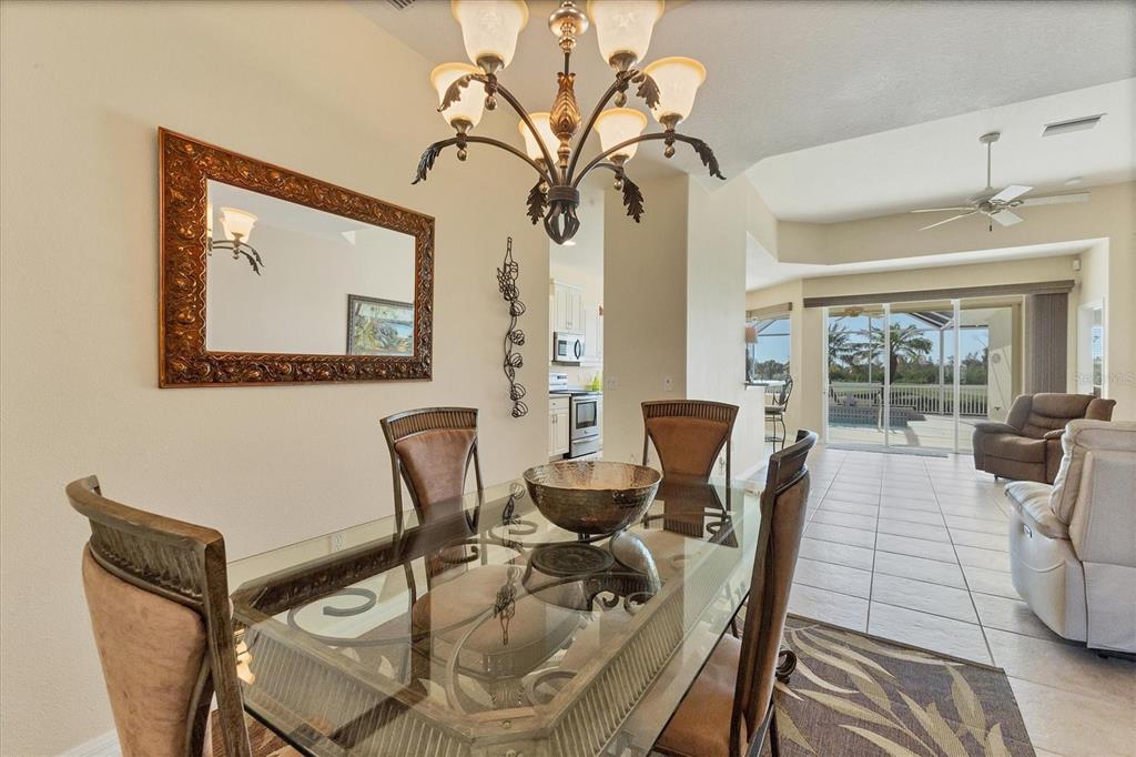 105 Westwind Drive Placida, FL 33946 - Photo 14 of 40 a living room with furniture and a large window