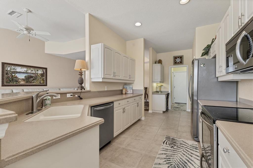 105 Westwind Drive Placida, FL 33946 - Photo 15 of 40 a bathroom with a sink a washer and dryer