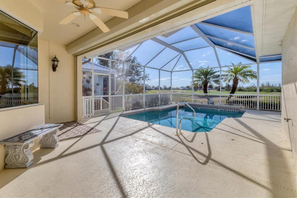 105 Westwind Drive Placida, FL 33946 - Photo 19 of 40 a view of a swimming pool with a patio