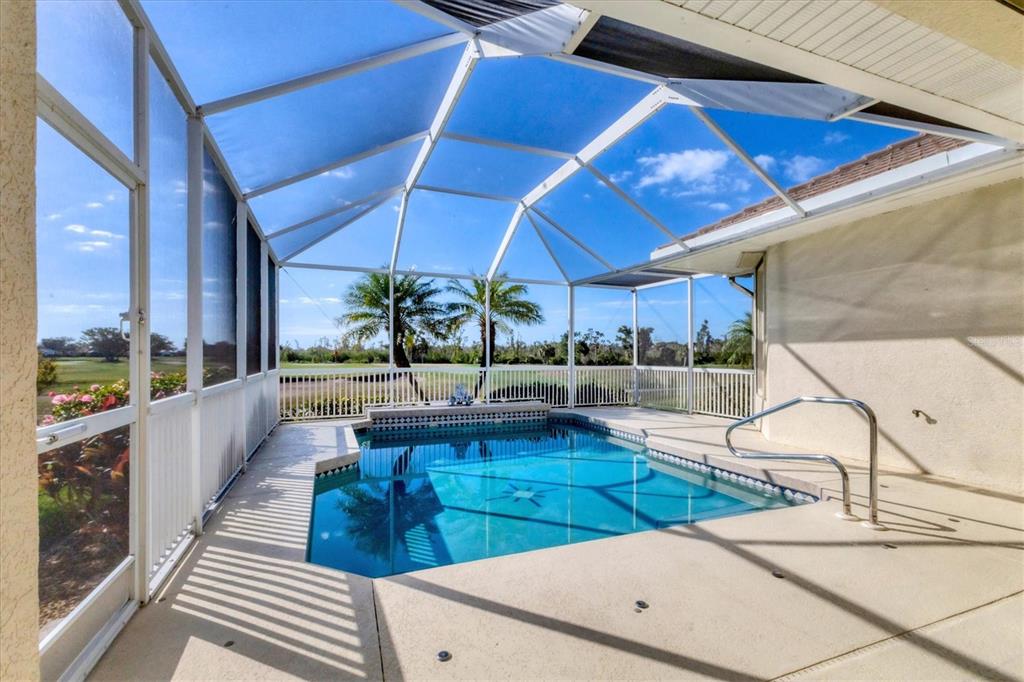 105 Westwind Drive Placida, FL 33946 - Photo 20 of 40 a swimming pool with outdoor seating
