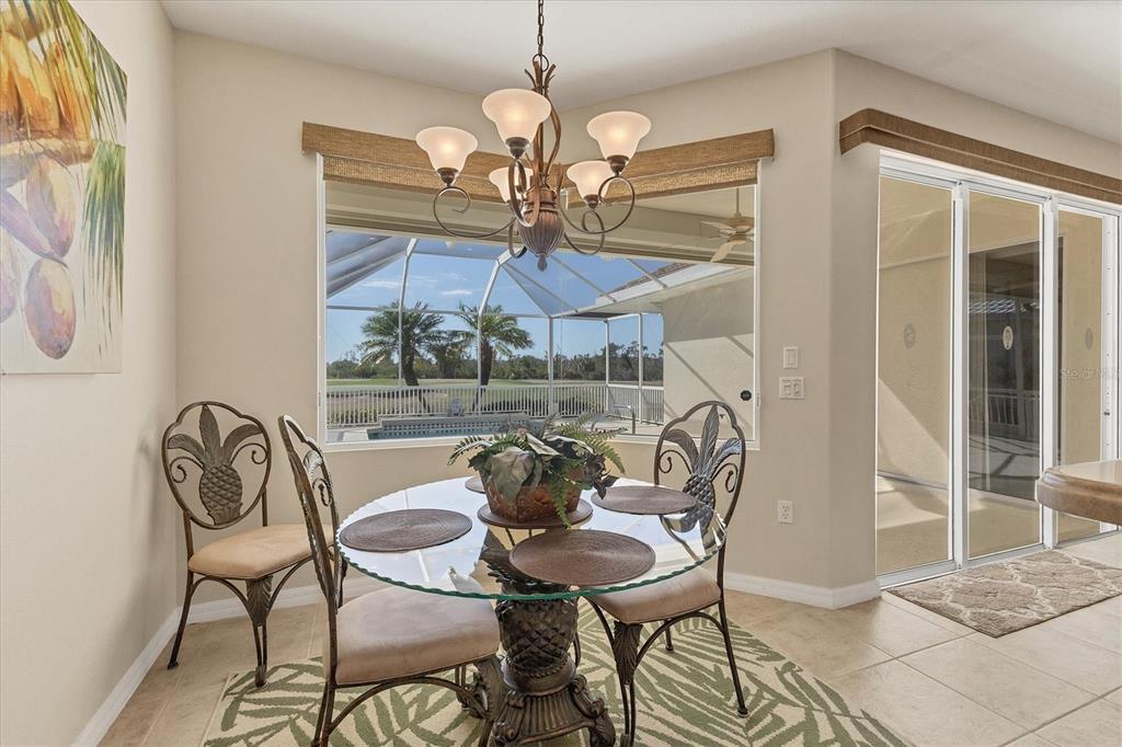 105 Westwind Drive Placida, FL 33946 - Photo 23 of 40 a view of a dining room with furniture and chandelier