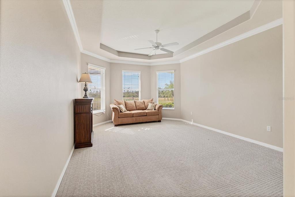 105 Westwind Drive Placida, FL 33946 - Photo 24 of 40 a living room with furniture and a chandelier