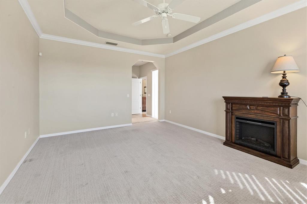 105 Westwind Drive Placida, FL 33946 - Photo 25 of 40 a view of empty room with fireplace and fan