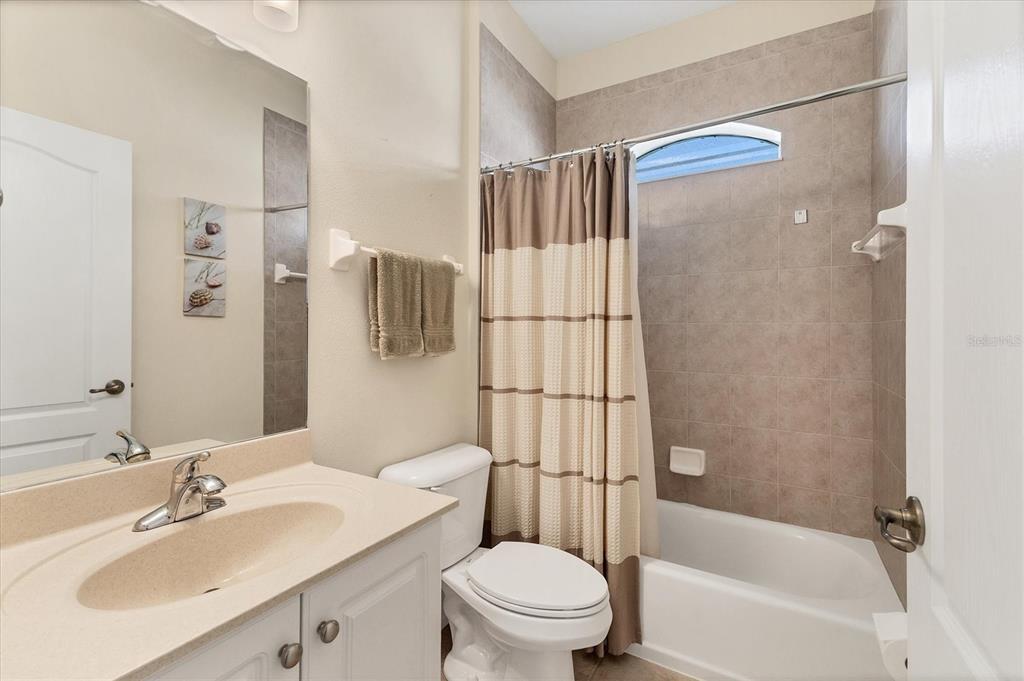 105 Westwind Drive Placida, FL 33946 - Photo 29 of 40 a bathroom with a sink toilet and shower