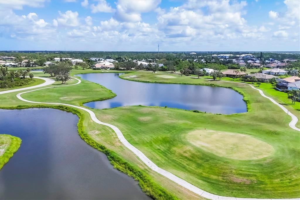 105 Westwind Drive Placida, FL 33946 - Photo 3 of 40 a view of a swimming pool with a yard
