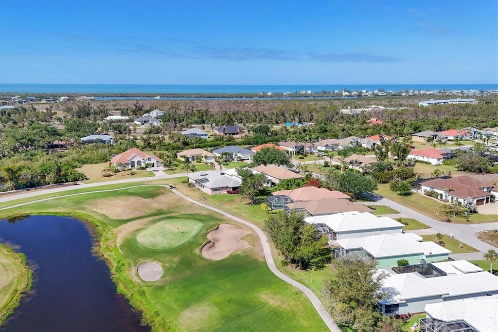105 Westwind Drive Placida, FL 33946 - Photo 35 of 40 an aerial view of residential houses with outdoor space and ocean view