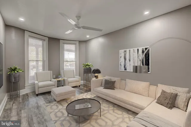 a view of a hallway with wooden floor and entryway