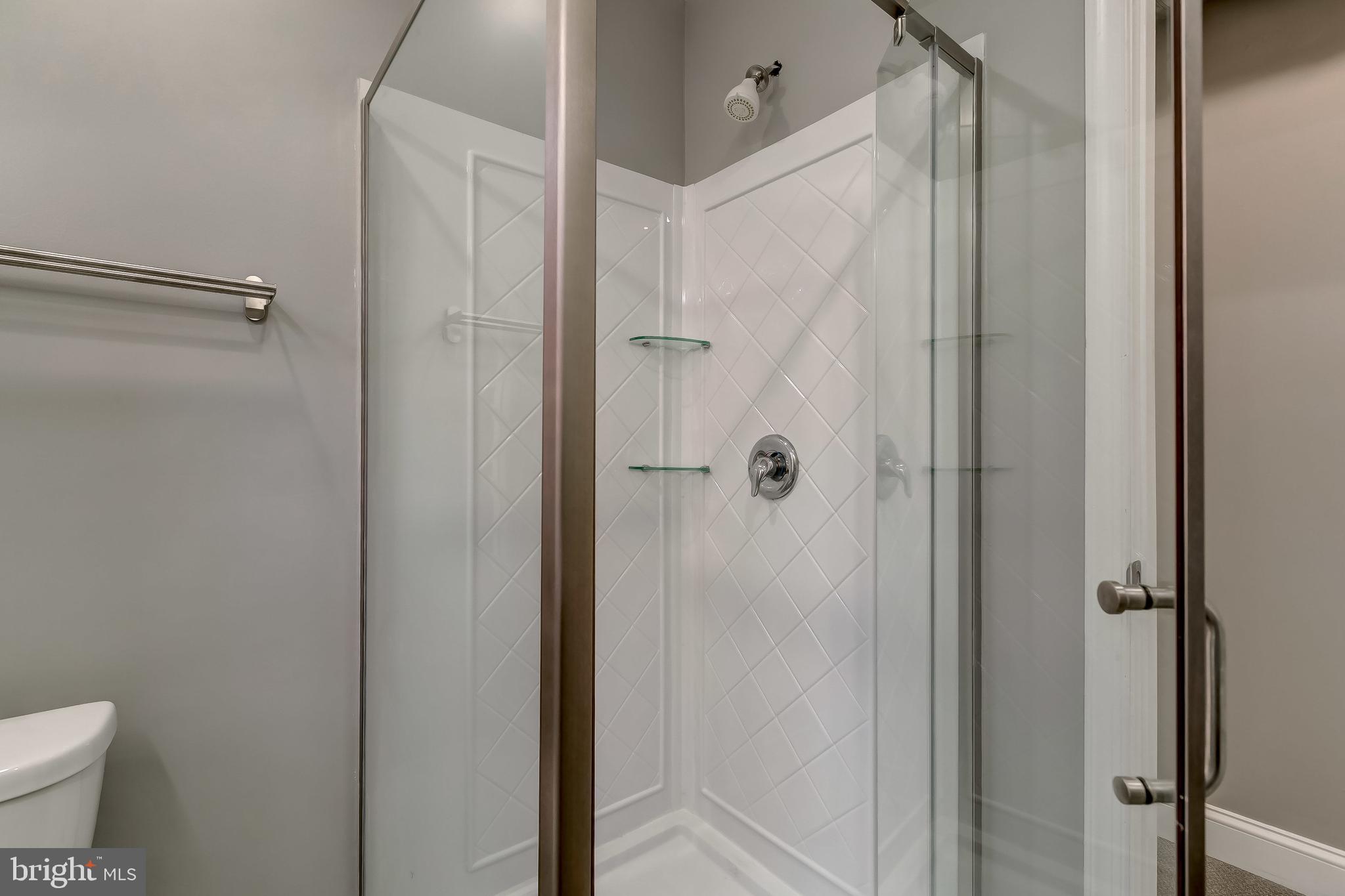 3600 Keswick Road, Unit A Baltimore, MD 21211 - Photo 23 of 43 a bathroom with a shower and a toilet