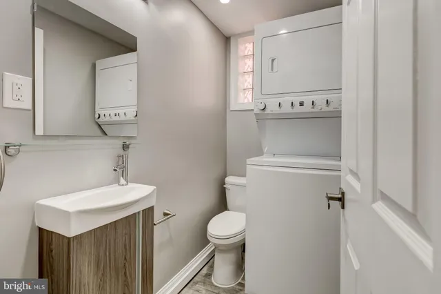 a kitchen with stainless steel appliances kitchen island granite countertop a sink and cabinets