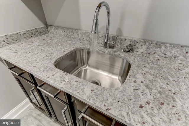 a stove top oven sitting inside of a kitchen