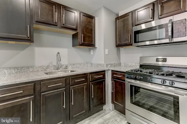 a view of a patio with a table and chairs