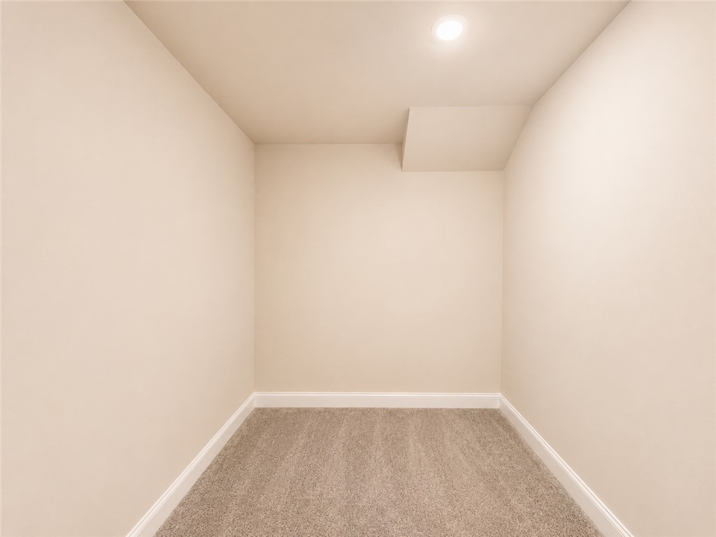328 Point Road Westminster, SC 29693 - Photo 18 of 24 A well-lit, compact room with soft carpeting, perfect for storage or a quiet nook.