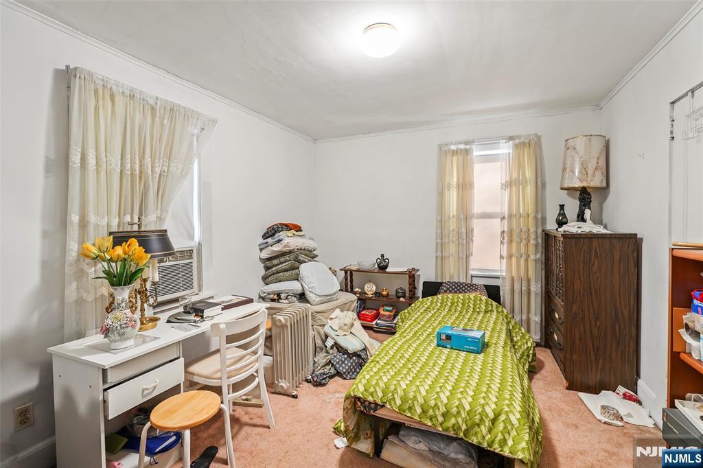 25 Ralph Street Bergenfield, NJ 07621 - Photo 11 of 17 a view of a workspace with furniture and a window