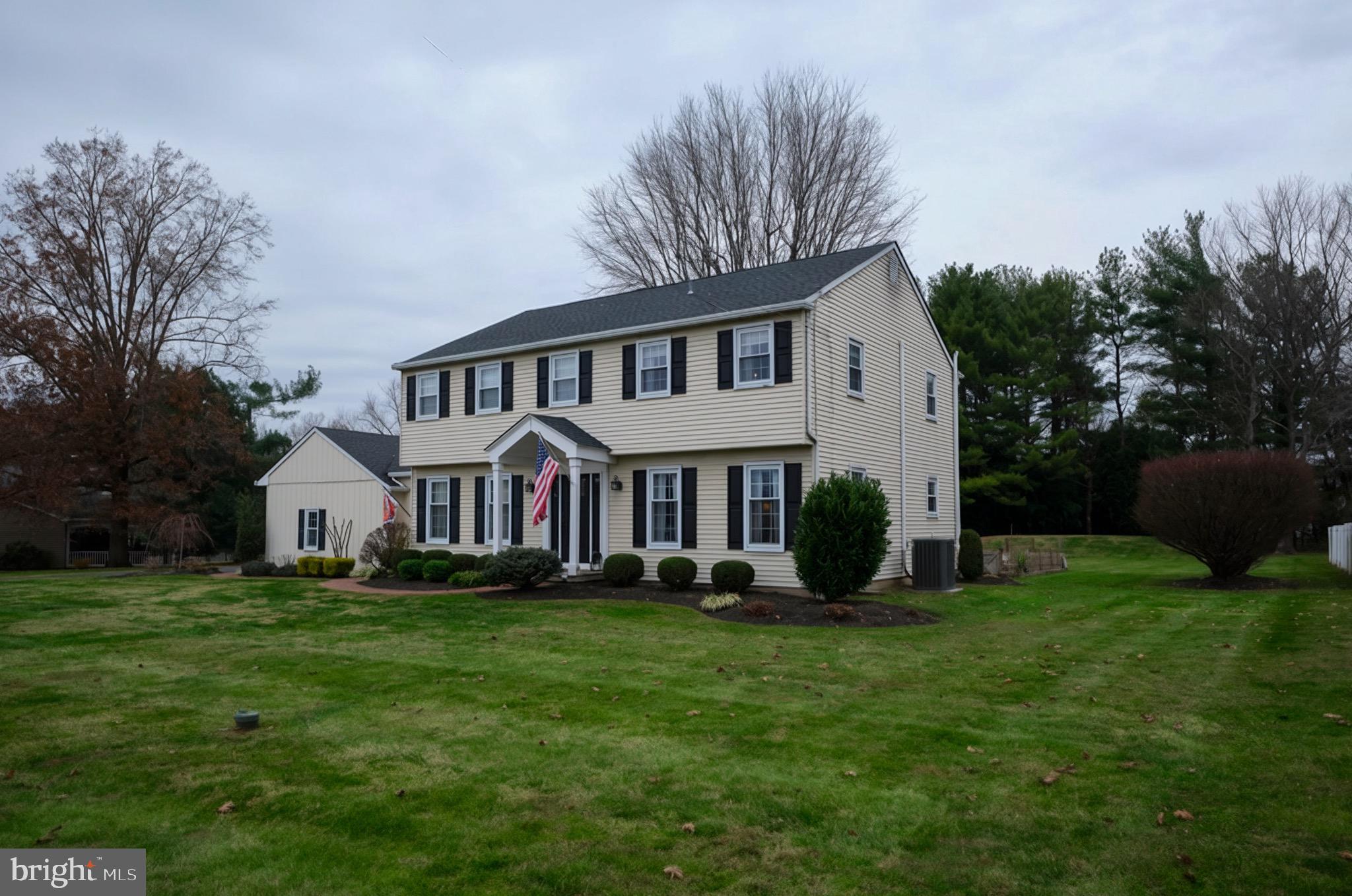225 Chestnut Valley Drive Doylestown, PA 18901 - Photo 2 of 46 a front view of a house with a yard and trees