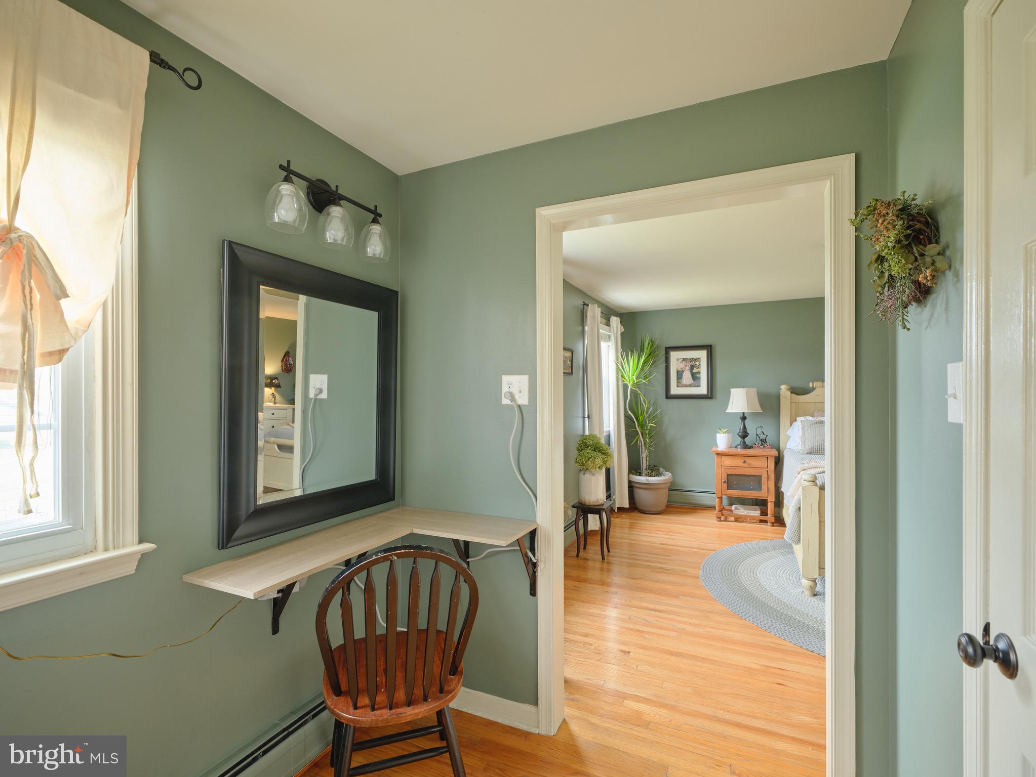 225 Chestnut Valley Drive Doylestown, PA 18901 - Photo 22 of 46 a view of a hallway with a livingroom and dining area with wooden floor