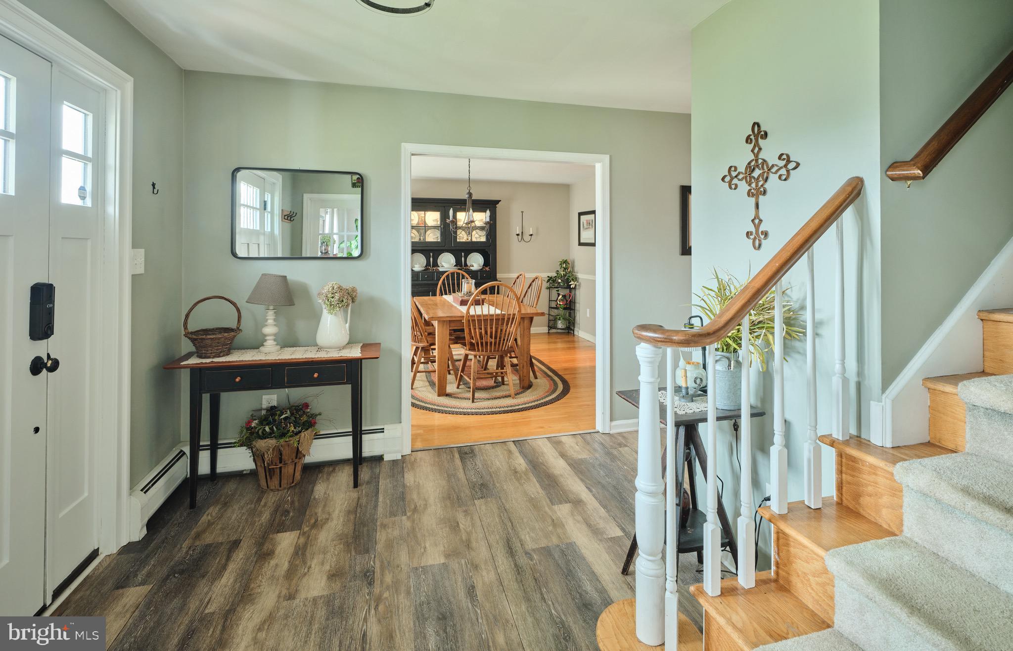 225 Chestnut Valley Drive Doylestown, PA 18901 - Photo 5 of 46 a dining room with wooden floor and a table