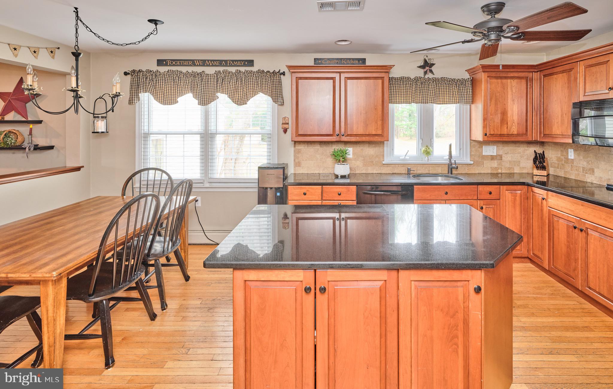 225 Chestnut Valley Drive Doylestown, PA 18901 - Photo 9 of 46 a kitchen with granite countertop a sink a counter top space cabinets and stainless steel appliances