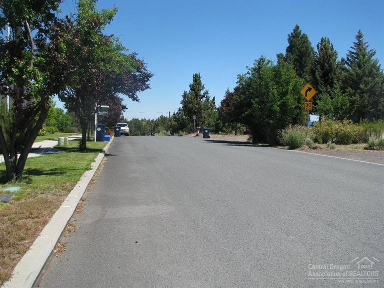 63323 Vogt Road Bend, OR 97701 - Photo 7 of 18 a view of a road with a trees in the background