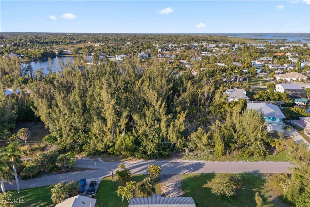 5480 Ann Arbor Drive Bokeelia, FL 33922 - Photo 2 of 12 an aerial view of residential houses with outdoor space