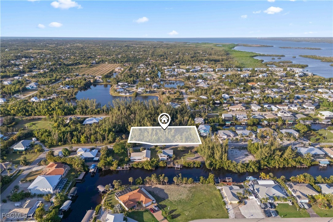 5480 Ann Arbor Drive Bokeelia, FL 33922 - Photo 9 of 12 an aerial view of a city with lots of residential buildings