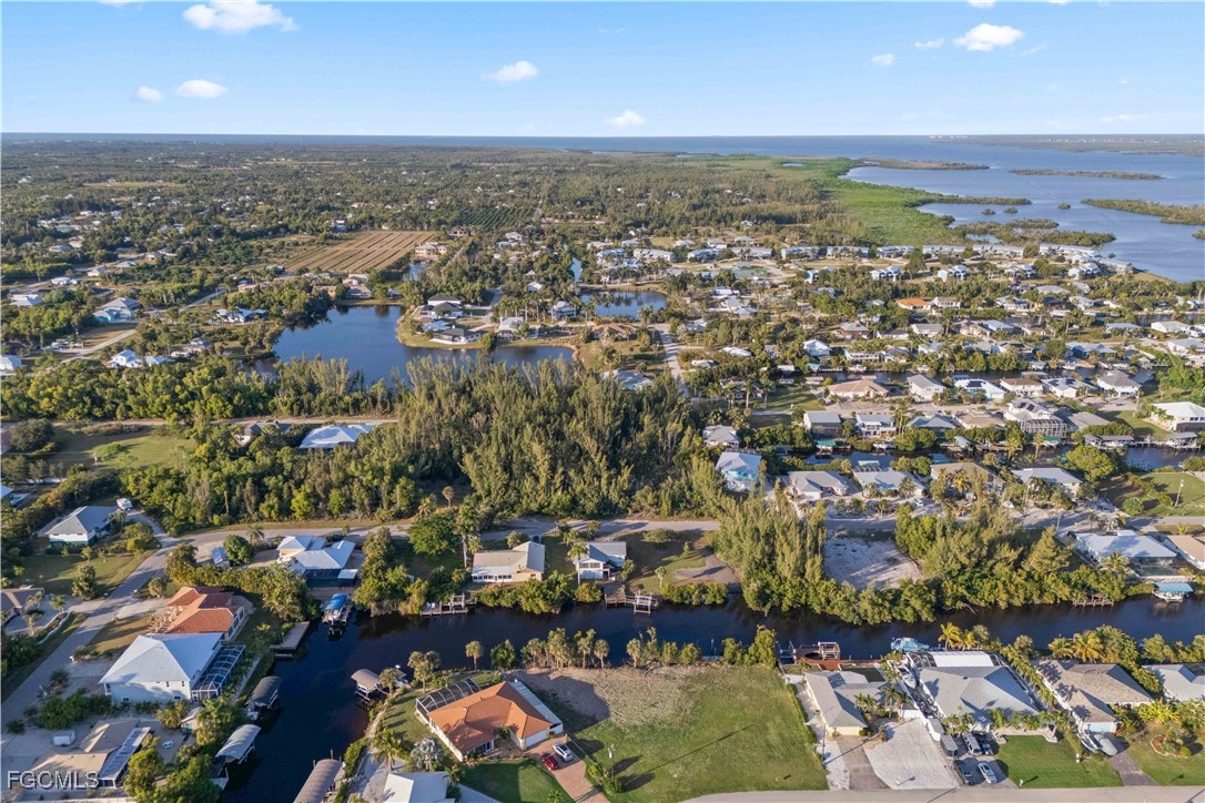 5480 Ann Arbor Drive Bokeelia, FL 33922 - Photo 10 of 12 an aerial view of a city with lots of residential buildings