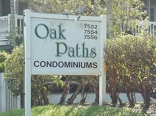 a sign broad on a brick wall