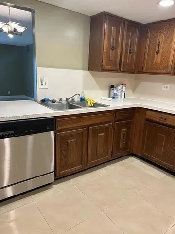 a kitchen with a sink and cabinets