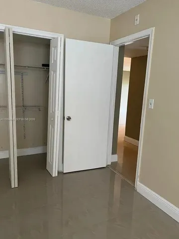 an empty room and closet area