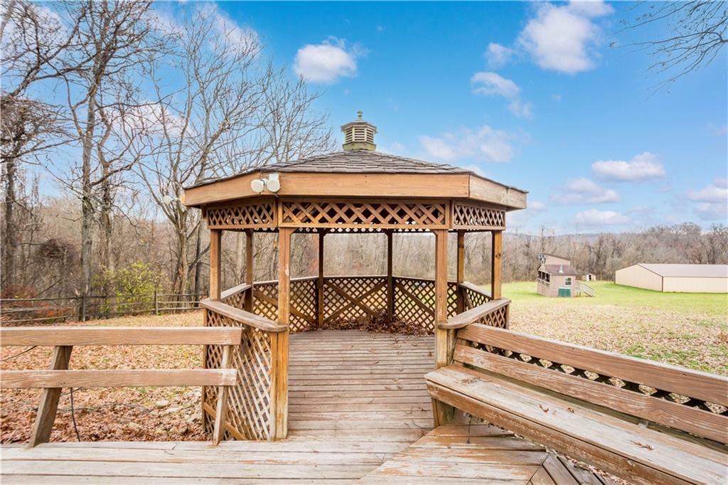 375 Wray Large Road Clairton, PA 15025 - Photo 32 of 47 a view of a roof deck with table and chairs a barbeque with wooden floor and fence