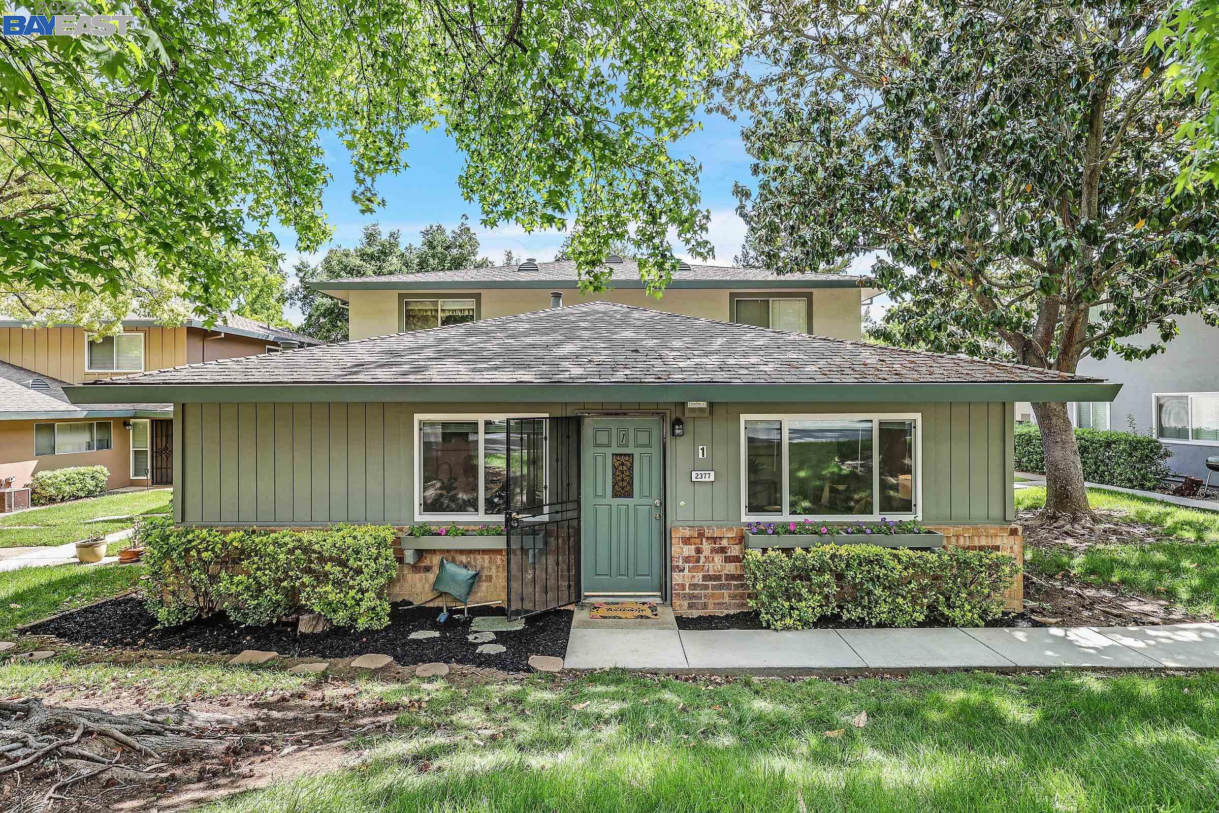 2377 Foothill Road, Unit 1 Pleasanton, CA 94588 - Photo 1 of 1 front view of a house with a yard