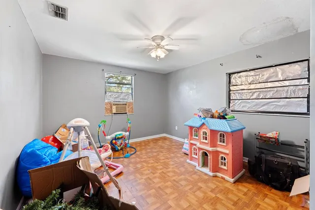 a bedroom with furniture and a window