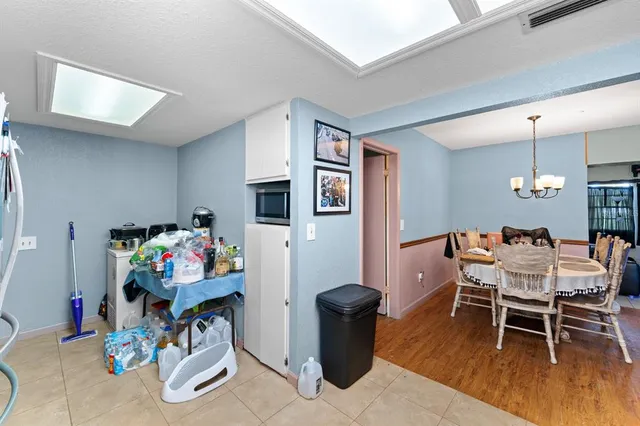 a dining room with a wooden floor and breakfast area