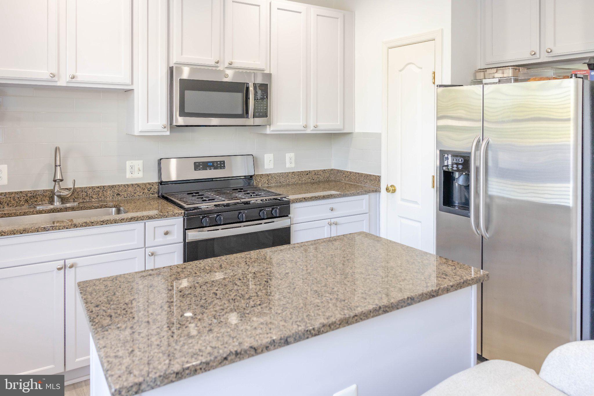 12824 Clarksburg Square Road, Unit 105 Clarksburg, MD 20871 - Photo 38 of 96 Modern kitchen with sleek finishes.