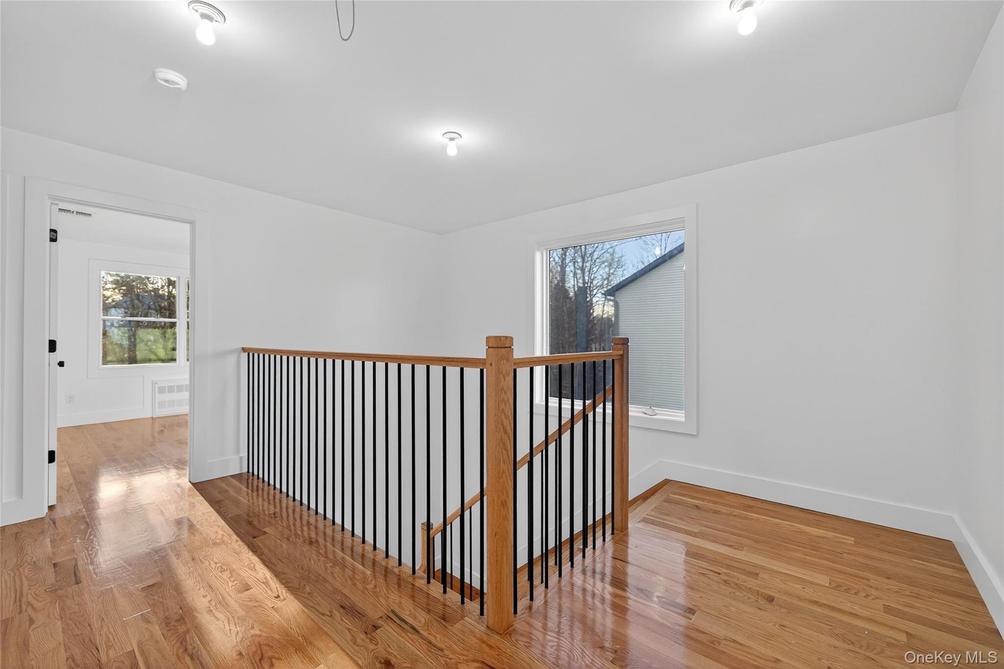 12 East Dillon Road Monticello, NY 12701 - Photo 21 of 47 a view of a hallway with wooden floor and windows