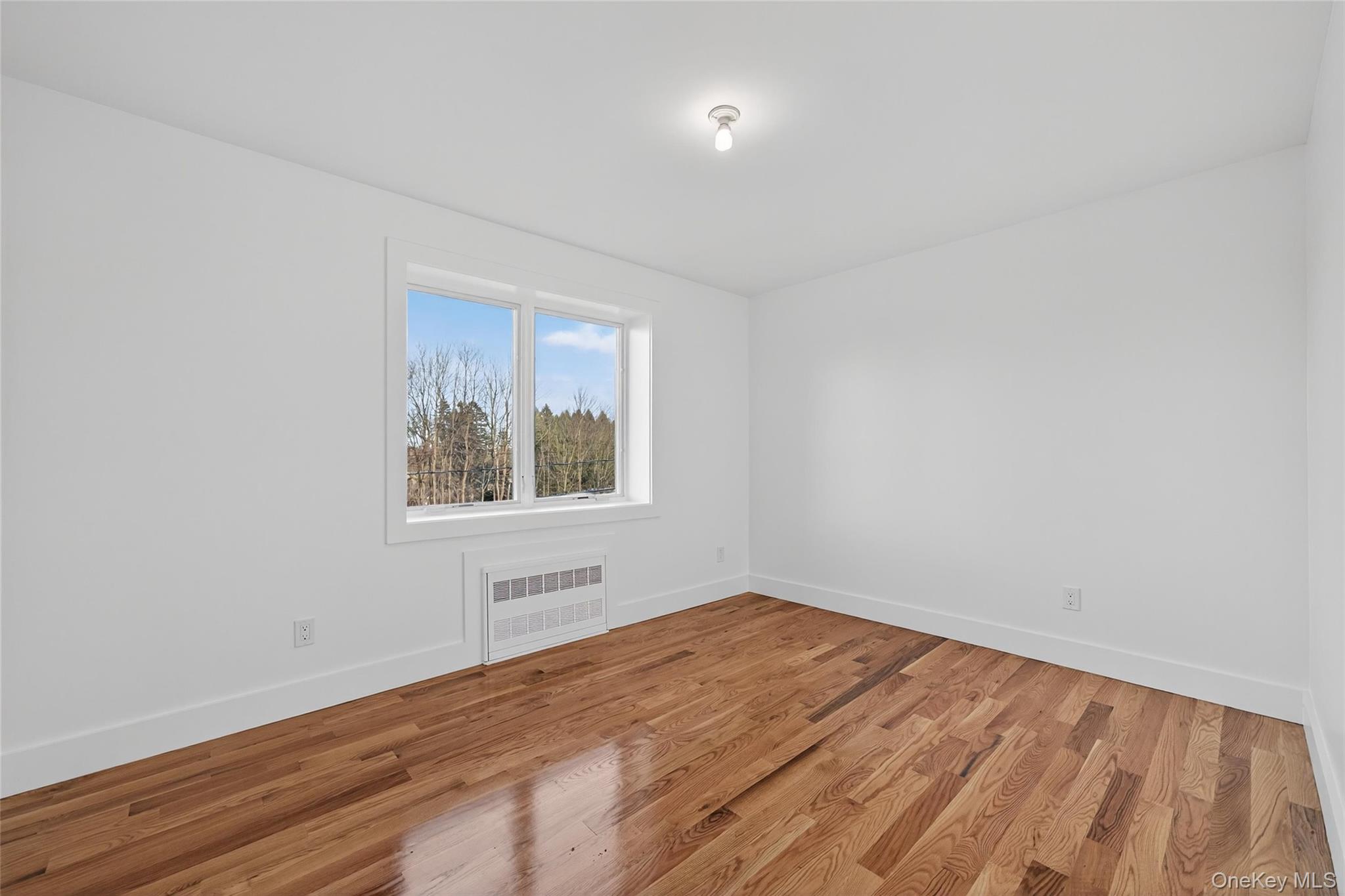 12 East Dillon Road Monticello, NY 12701 - Photo 29 of 47 a view of empty room with wooden floor and fan