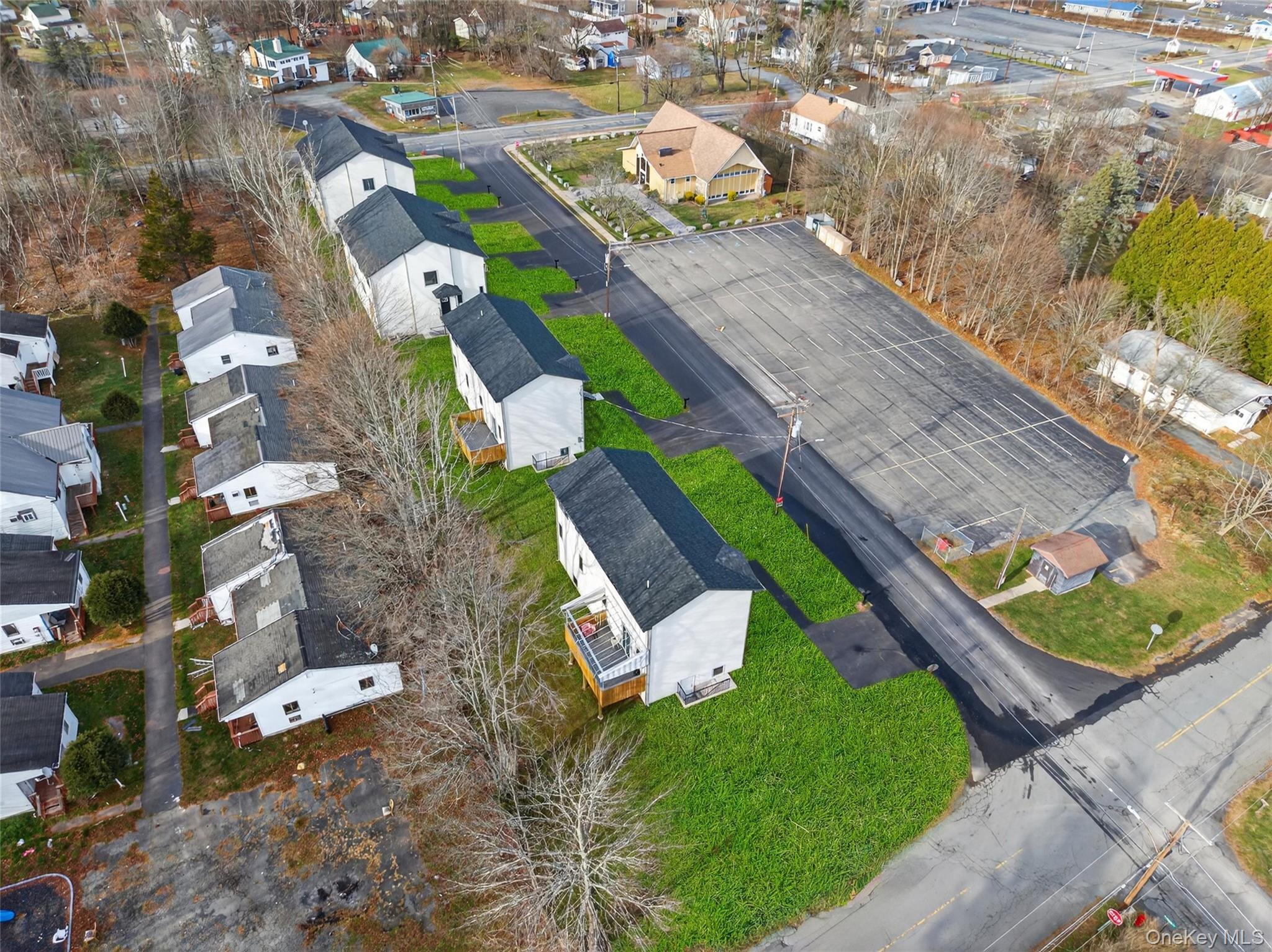 12 East Dillon Road Monticello, NY 12701 - Photo 37 of 47 an aerial view of a house a yard and mountain