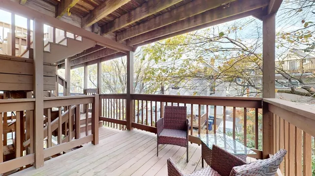 a view of a chairs on wooden deck