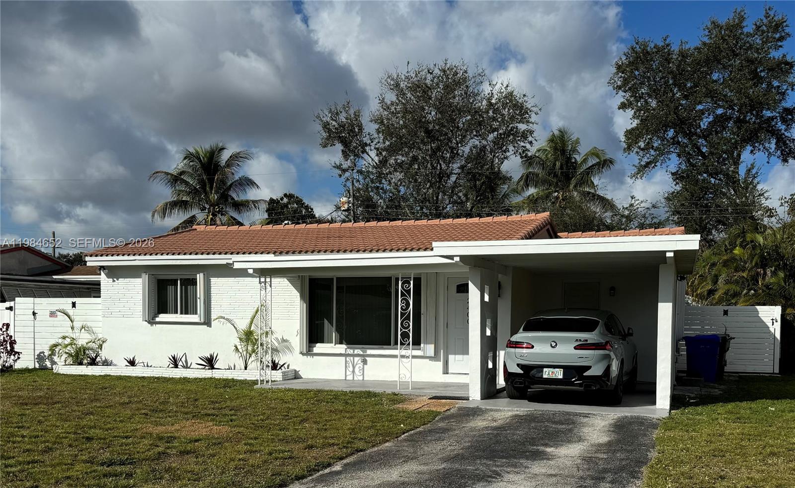 2400 North 57th Way Hollywood, FL 33021 - Photo 5 of 9 a front view of a house with garden