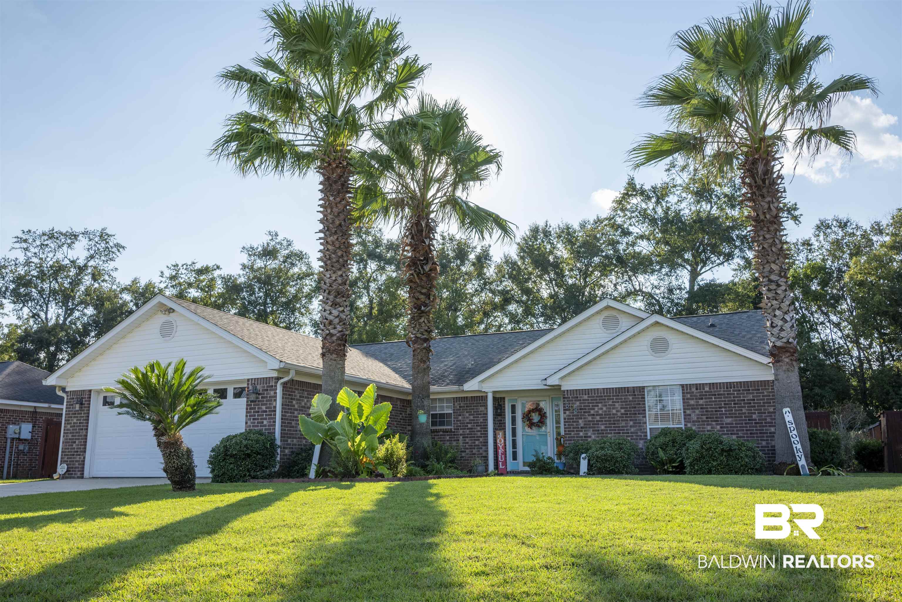 808 Wisteria Lane Foley, AL 36535 - Photo 1 of 19 Single story home with a front yard and a garage