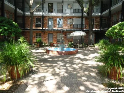 a bathroom with a sink a washer and dryer