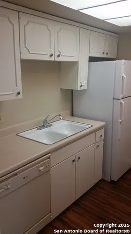 a view of a kitchen with cabinets