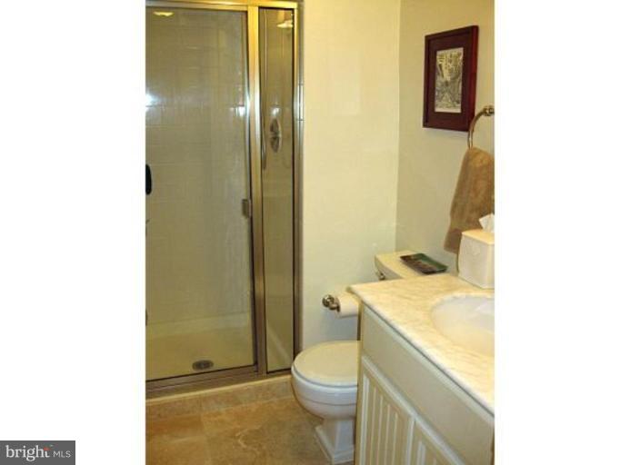 6105 Overlea Road Bethesda, MD 20816 - Photo 11 of 18 a bathroom with a granite countertop sink toilet and shower