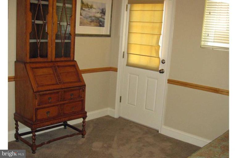 6105 Overlea Road Bethesda, MD 20816 - Photo 12 of 18 a view of a room with furniture and a window