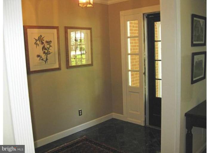 6105 Overlea Road Bethesda, MD 20816 - Photo 13 of 18 a view of an entryway with wooden floor