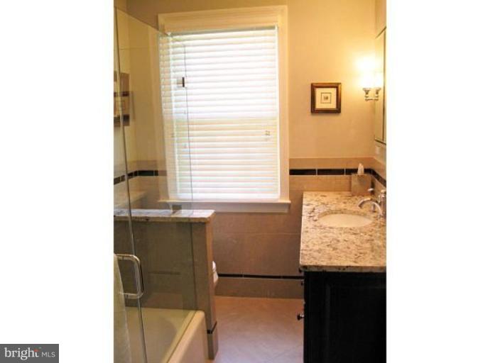 6105 Overlea Road Bethesda, MD 20816 - Photo 14 of 18 a bathroom with a sink and a vanity