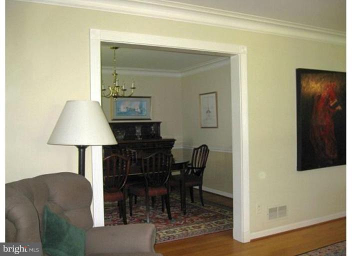 6105 Overlea Road Bethesda, MD 20816 - Photo 18 of 18 a view of a dining room with furniture and wooden floor
