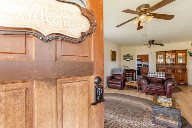 a kitchen with granite countertop wood cabinets stainless steel appliances and a counter space